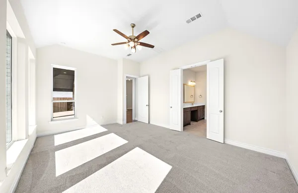 a view of a livingroom with a ceiling fan and window