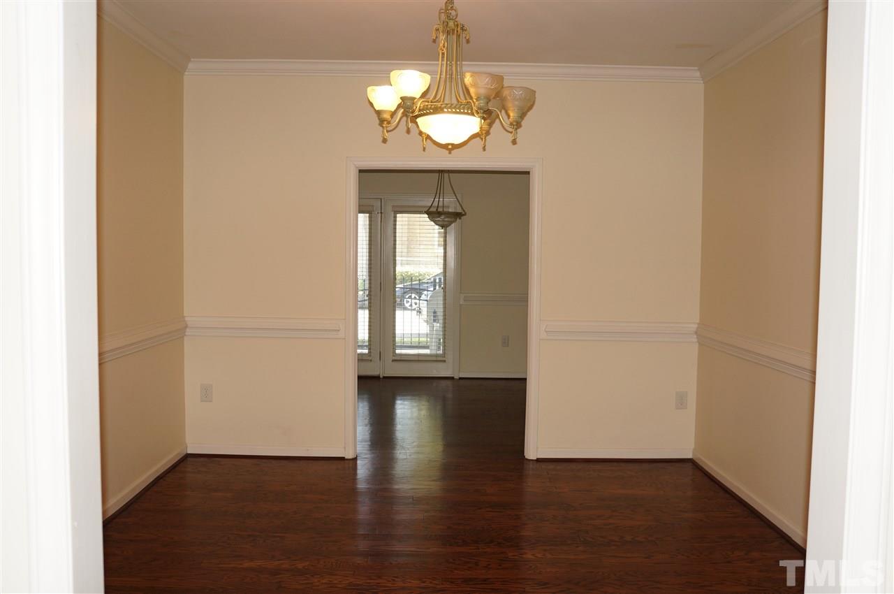 508 South Person Street, Unit 107 Raleigh, NC 27601 - Photo 11 of 24 an empty room with wooden floor mirror and windows