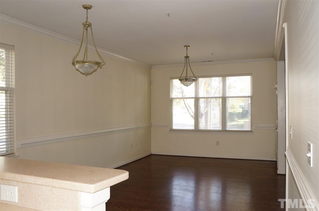 508 South Person Street, Unit 107 Raleigh, NC 27601 - Photo 12 of 24 a view of a room with wooden floor and windows