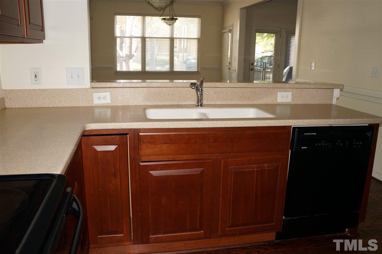 508 South Person Street, Unit 107 Raleigh, NC 27601 - Photo 14 of 24 a bathroom with a sink and a mirror