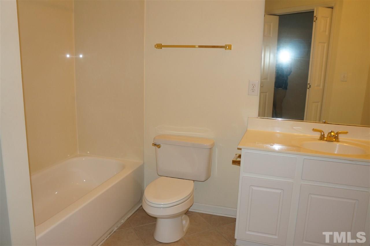 508 South Person Street, Unit 107 Raleigh, NC 27601 - Photo 16 of 24 a bathroom with a sink a toilet and shower