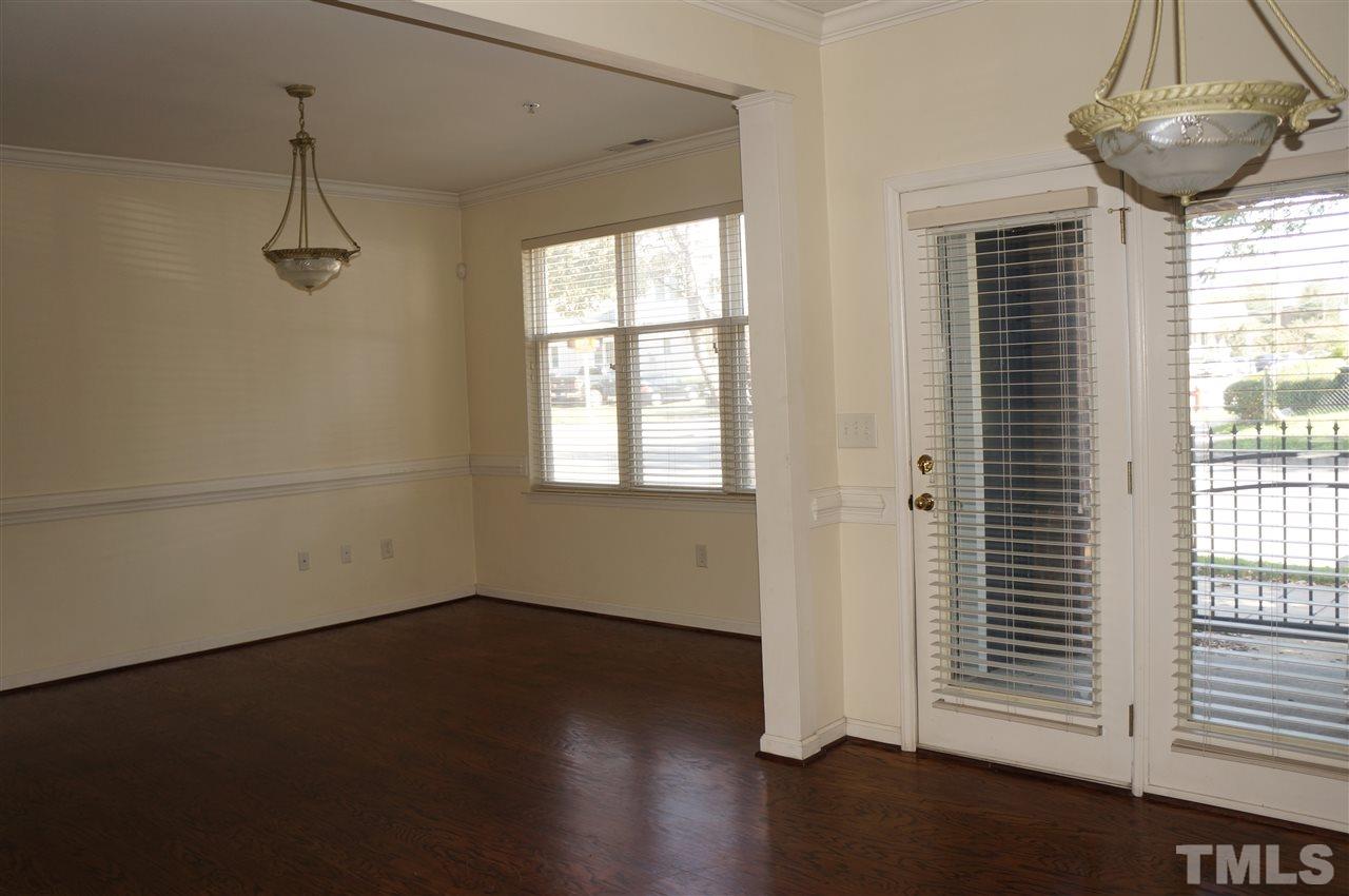 508 South Person Street, Unit 107 Raleigh, NC 27601 - Photo 22 of 24 a view of a room with wooden floor and windows