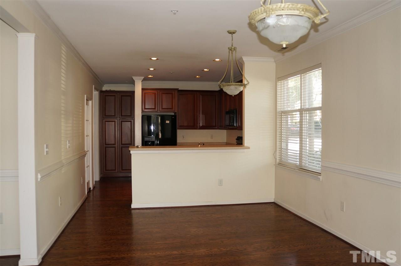 508 South Person Street, Unit 107 Raleigh, NC 27601 - Photo 23 of 24 an entryway with wooden floor and cabinets