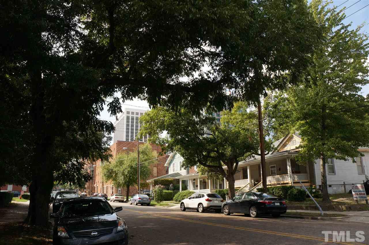 508 South Person Street, Unit 107 Raleigh, NC 27601 - Photo 5 of 24 a city street lined with buildings and cars parked on the roadside