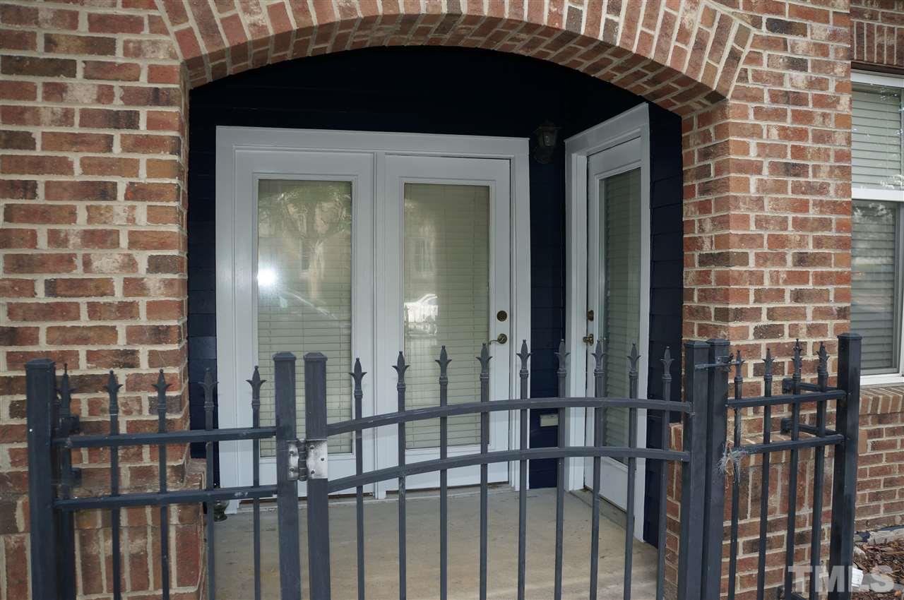 508 South Person Street, Unit 107 Raleigh, NC 27601 - Photo 8 of 24 a front view of a house with a glass door