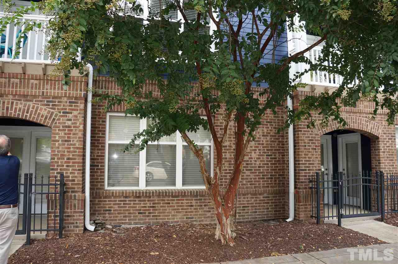 508 South Person Street, Unit 107 Raleigh, NC 27601 - Photo 9 of 24 a front view of a house with a tree