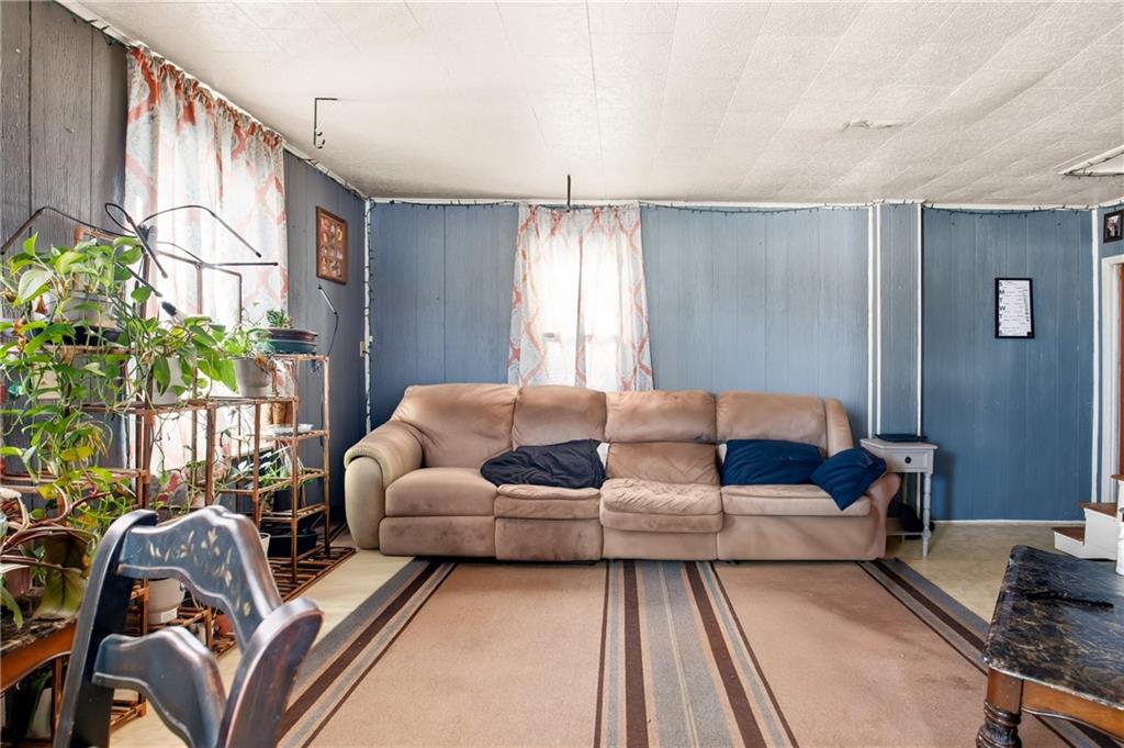 108 Foster Lane Markleton, PA 15551 - Photo 12 of 33 a living room with furniture fireplace and a window