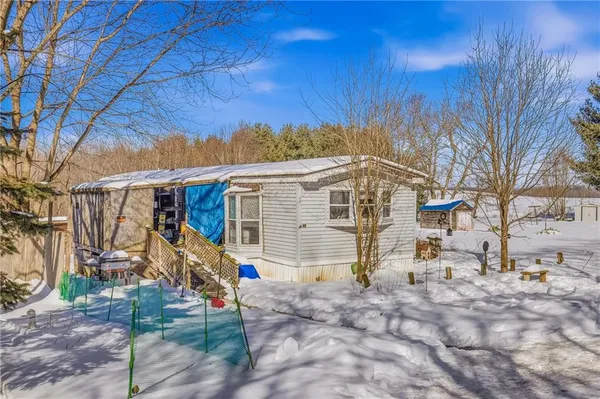 a view of a backyard of the house