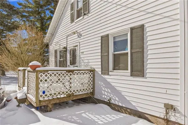 a view of a house with wooden fence