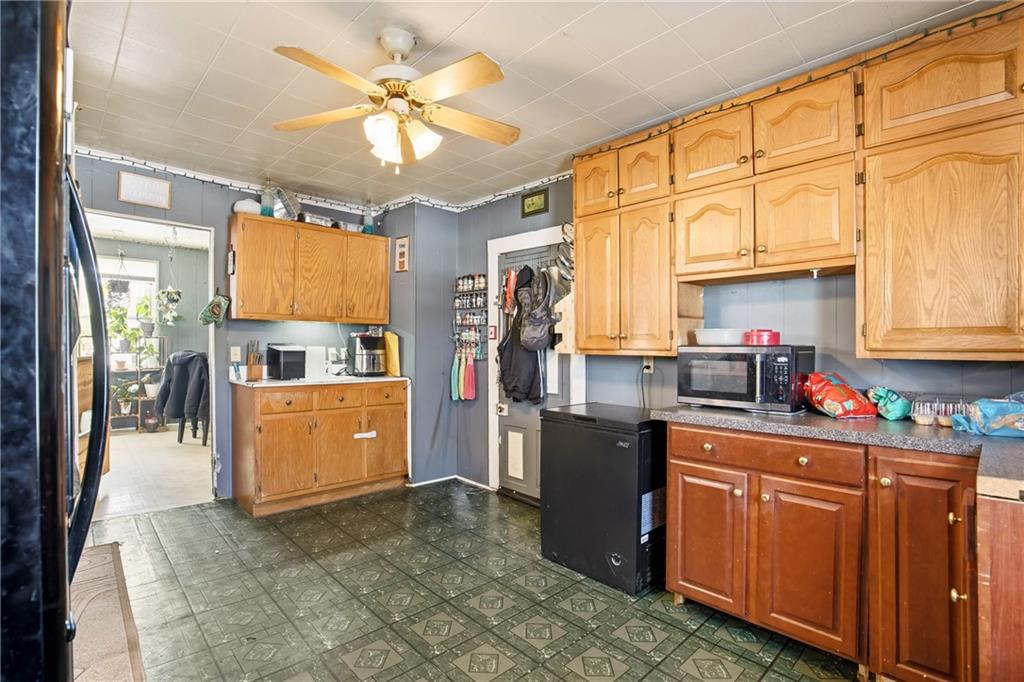 108 Foster Lane Markleton, PA 15551 - Photo 7 of 33 a kitchen with stainless steel appliances granite countertop a sink cabinets and window