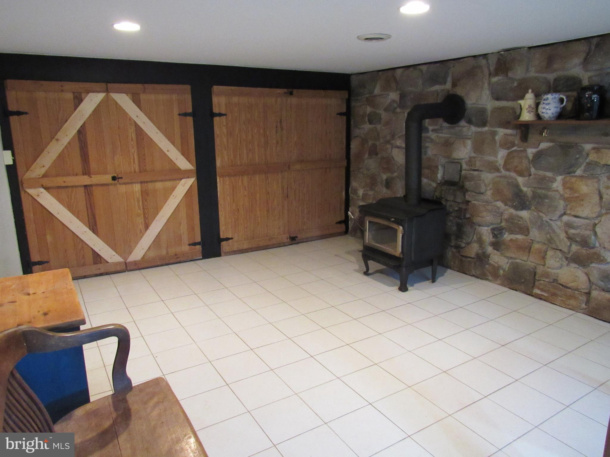 78 South Limerick Road Royersford, PA 19468 - Photo 45 of 59 finished bsmt family rm w/ wood stove