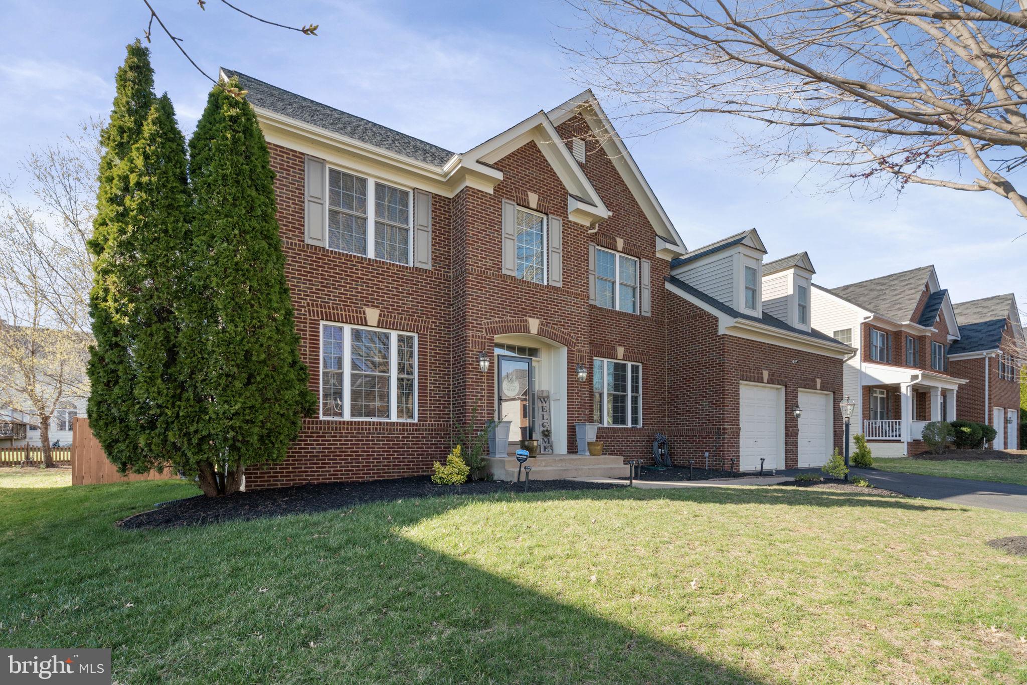 a view of a house with a yard and plants