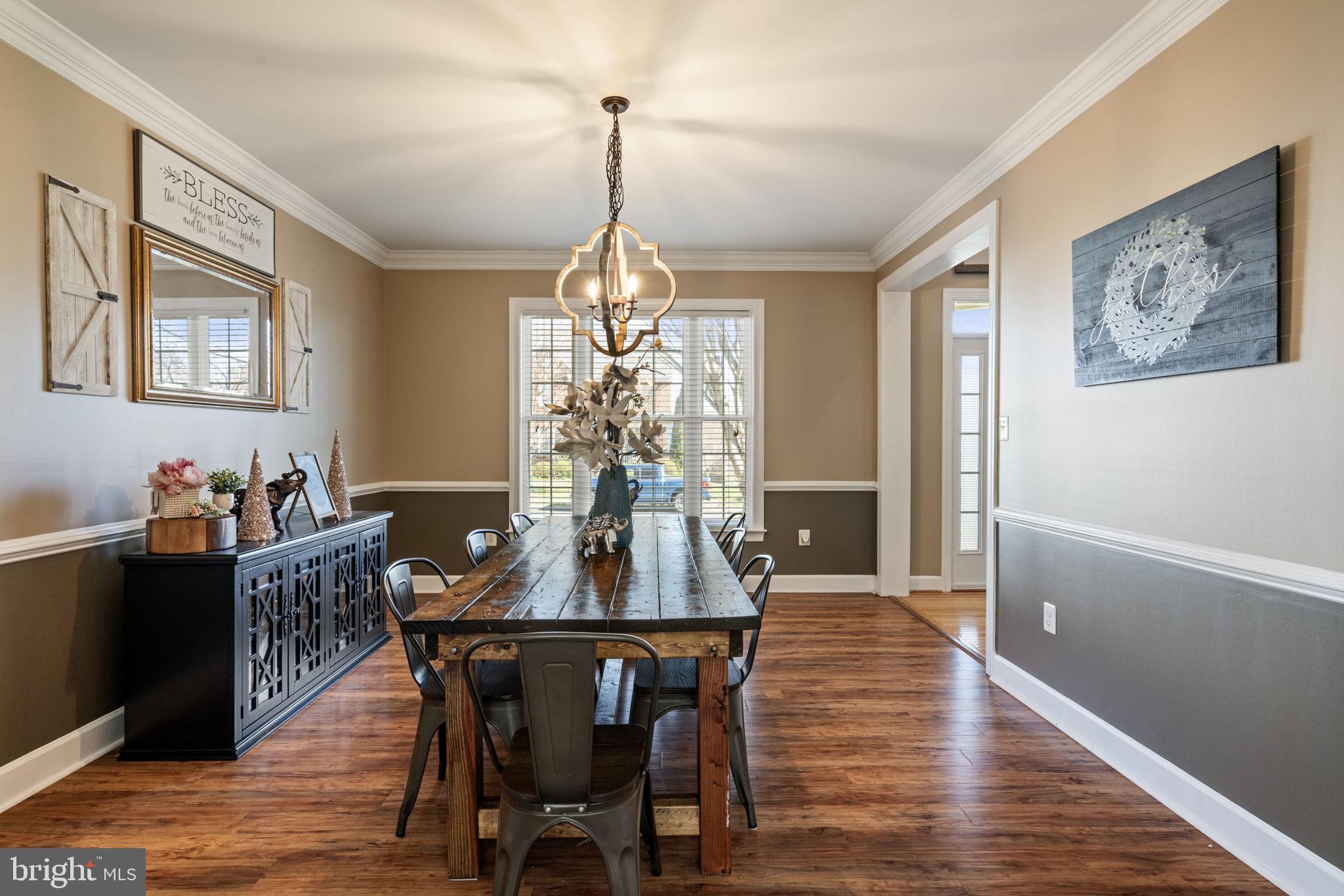 4016 Sapling Way Triangle, VA 22172 - Photo 11 of 56 a view of a dining room with furniture window and wooden floor