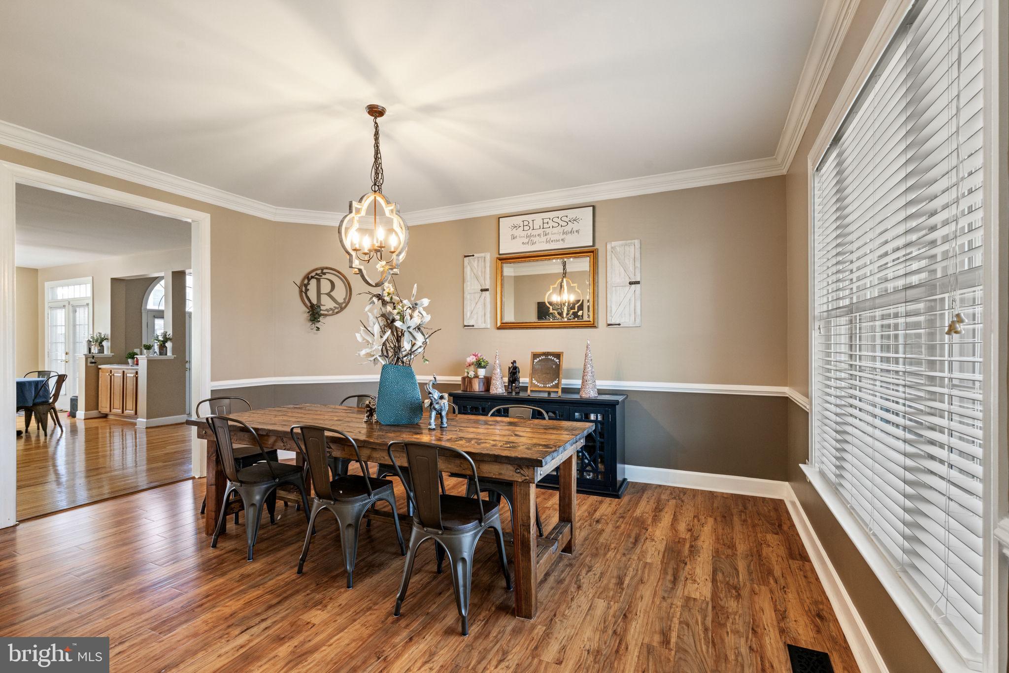 4016 Sapling Way Triangle, VA 22172 - Photo 12 of 56 a view of a dining room with furniture window and wooden floor