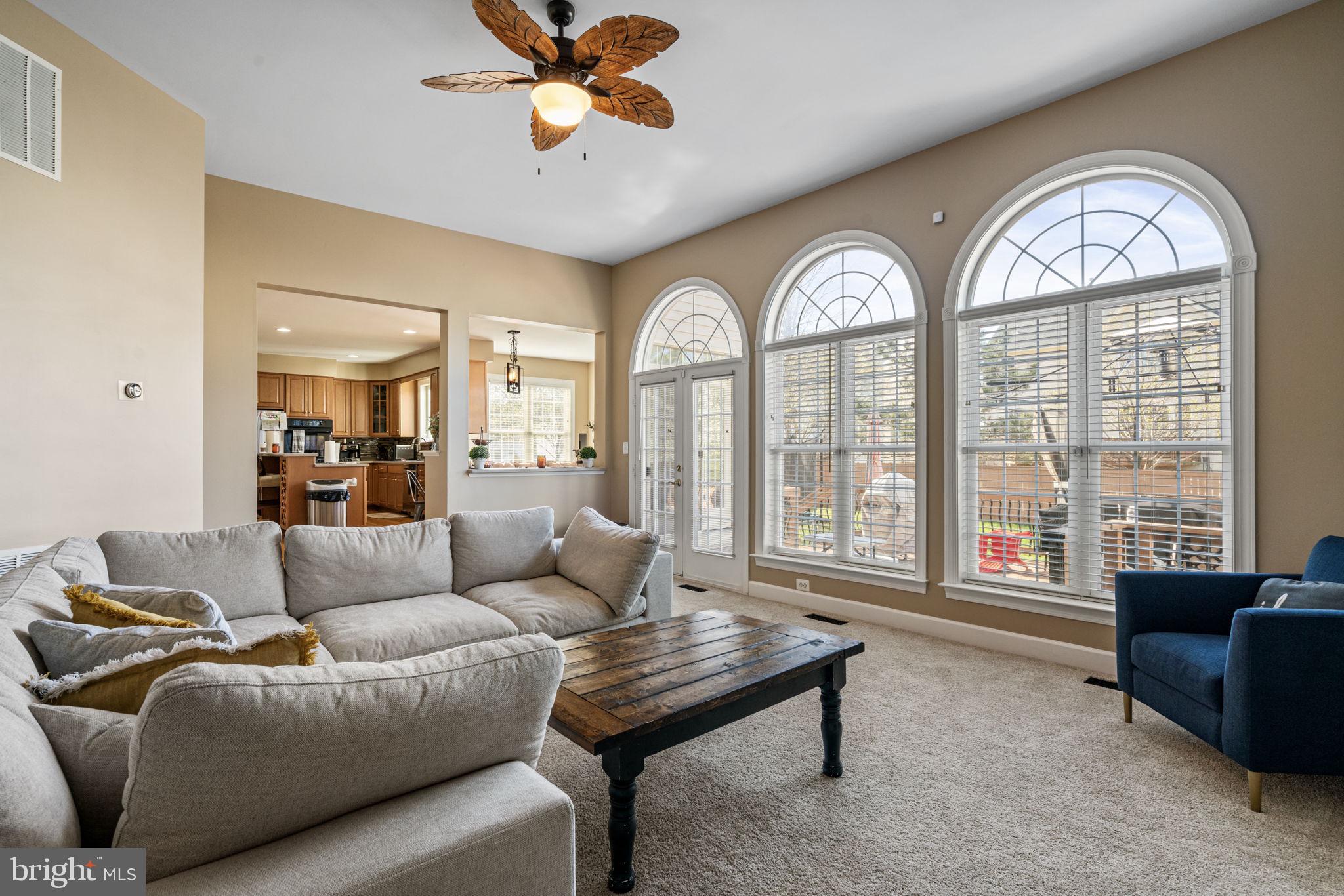 4016 Sapling Way Triangle, VA 22172 - Photo 21 of 56 a living room with furniture and a large window