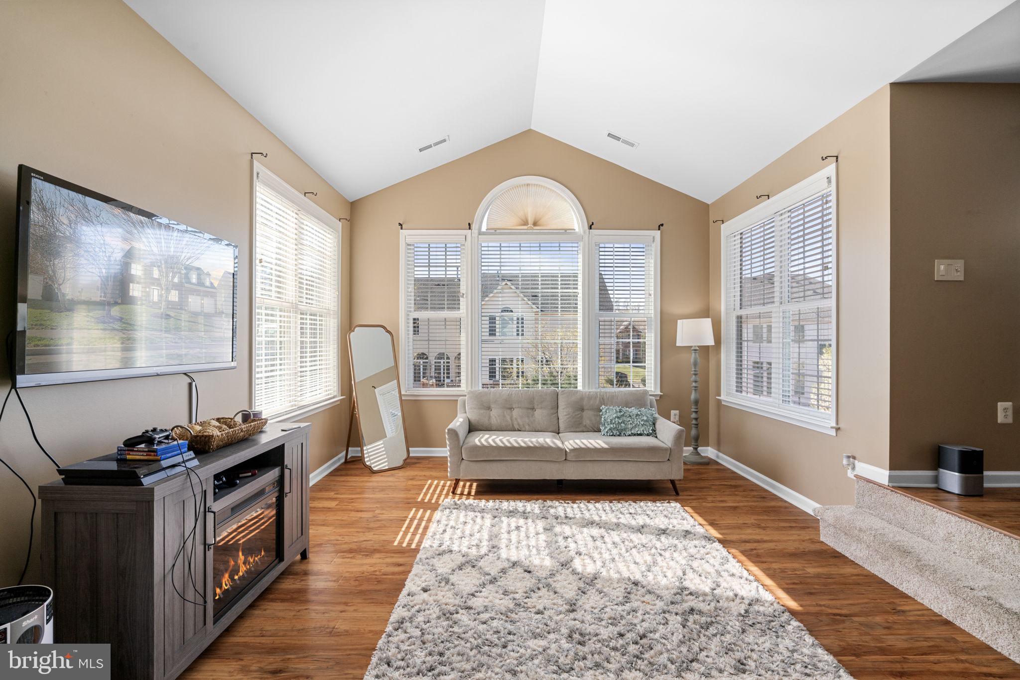 4016 Sapling Way Triangle, VA 22172 - Photo 25 of 56 a living room with furniture and a flat screen tv