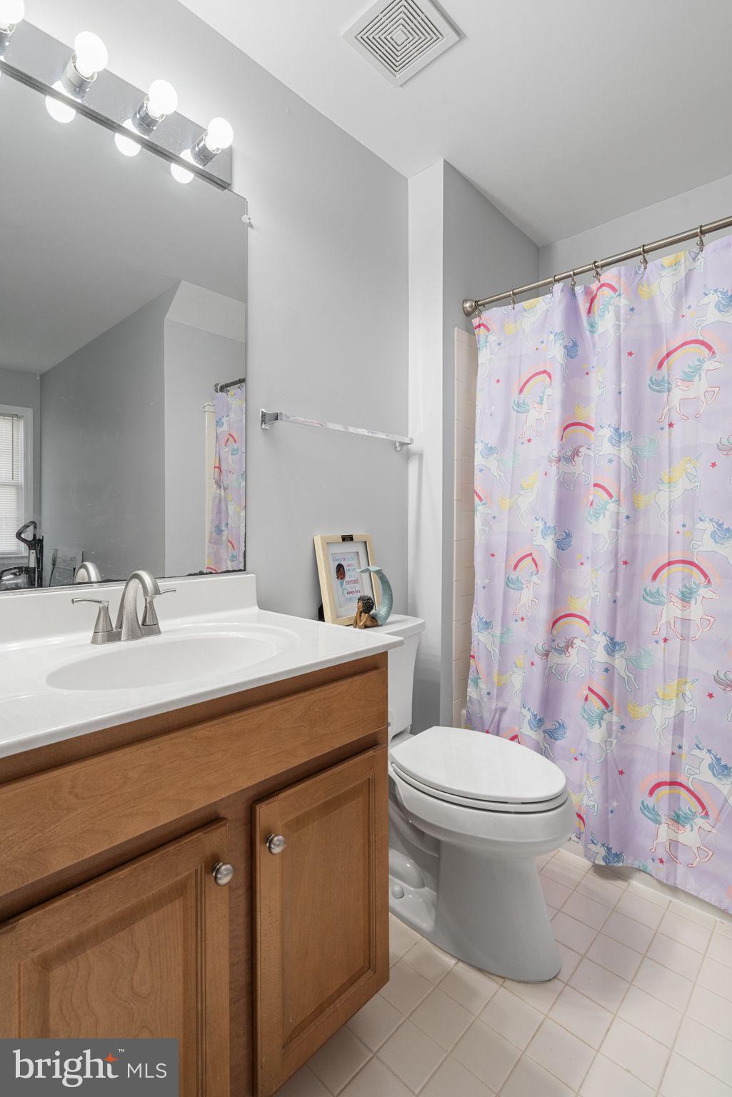 4016 Sapling Way Triangle, VA 22172 - Photo 40 of 56 a bathroom with a sink toilet vanity and shower
