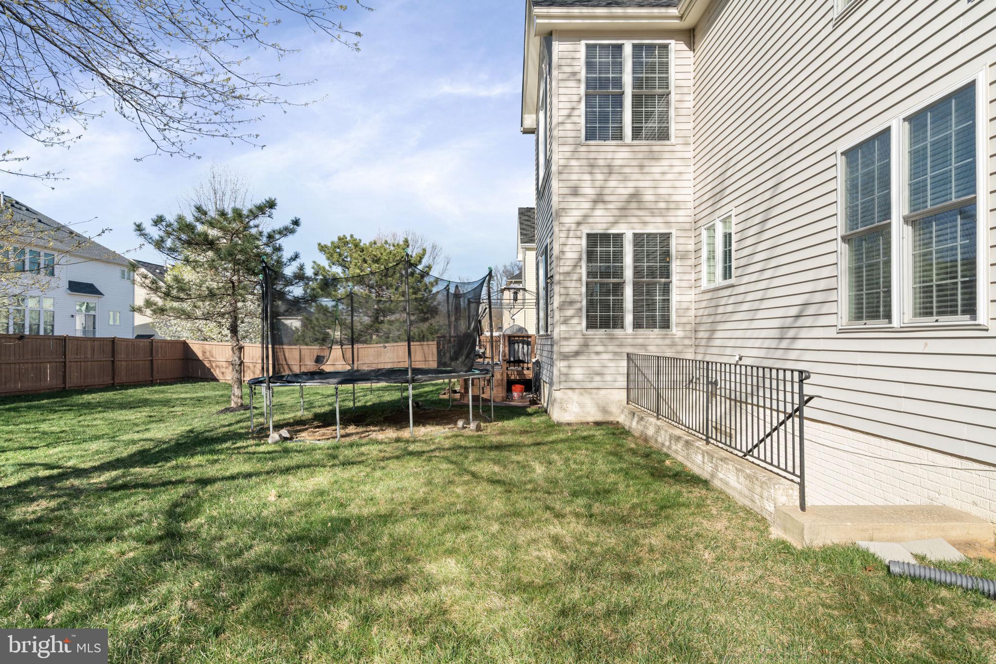4016 Sapling Way Triangle, VA 22172 - Photo 43 of 56 a view of a backyard with a large tree