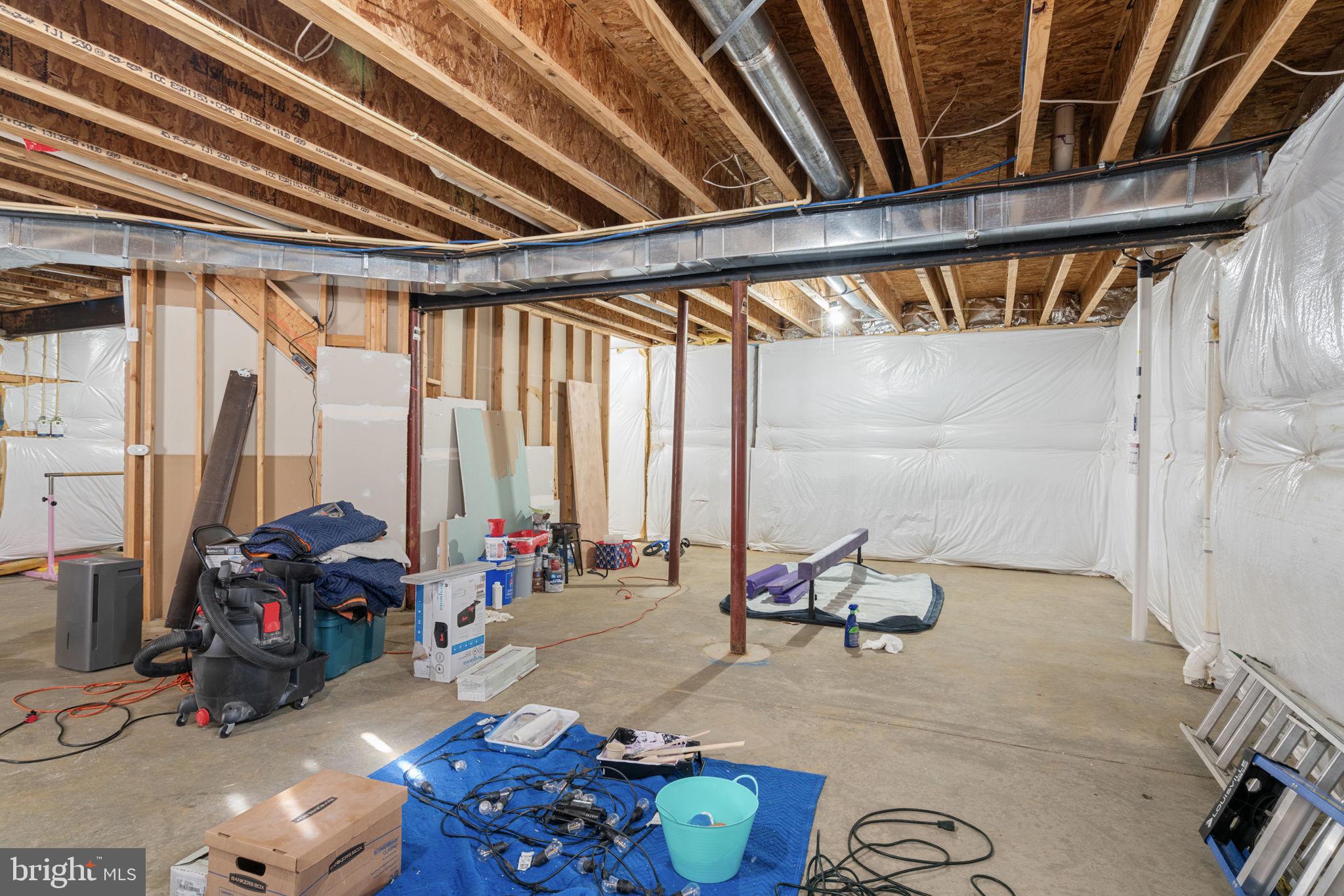 4016 Sapling Way Triangle, VA 22172 - Photo 46 of 56 a living room with furniture and floor to ceiling window