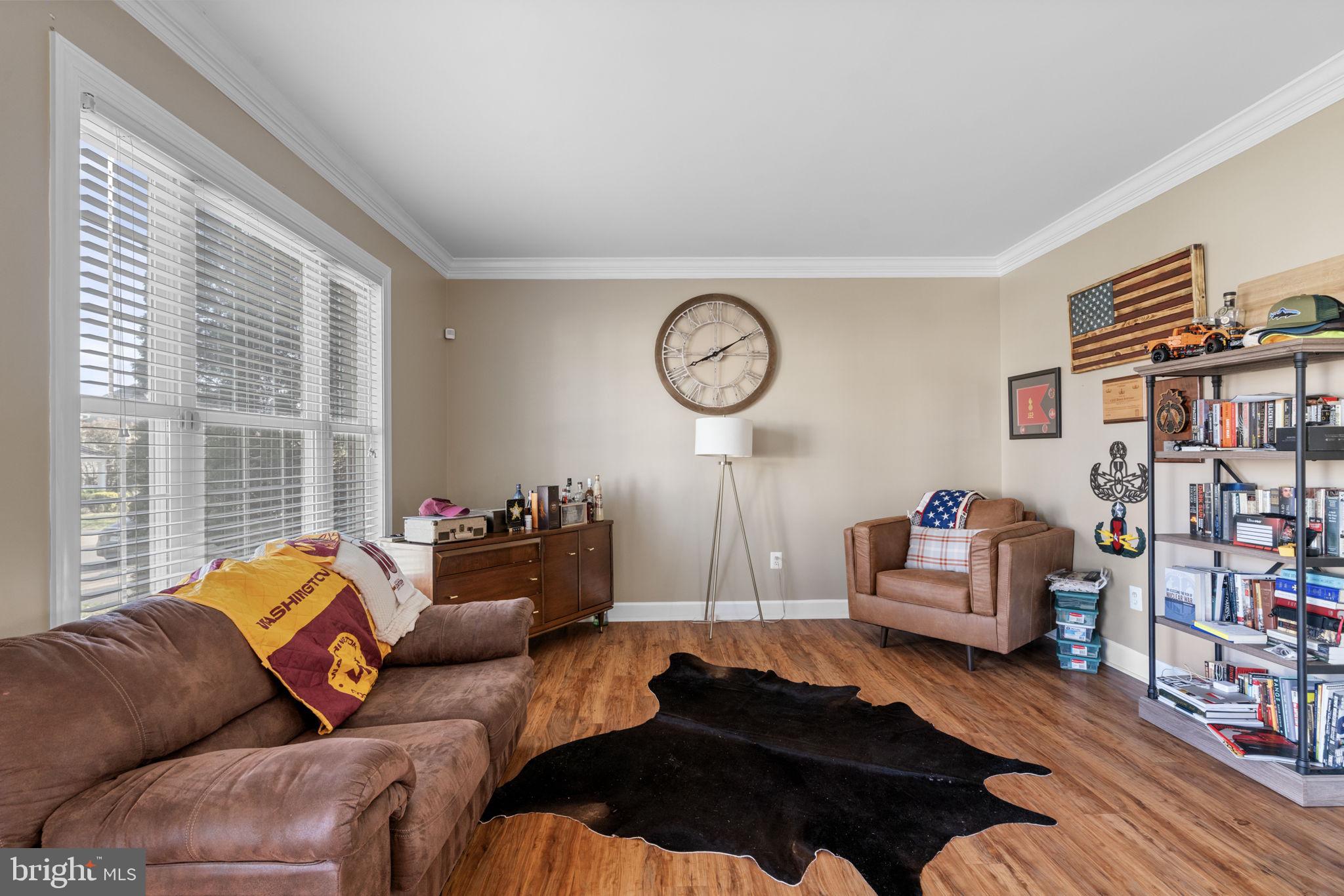 4016 Sapling Way Triangle, VA 22172 - Photo 9 of 56 a living room with furniture and a large window