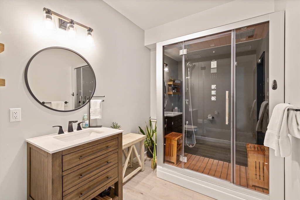 2 Leitner Way Middleton, MA 01949 - Photo 22 of 42 a bathroom with a sink a mirror a vanity and shower