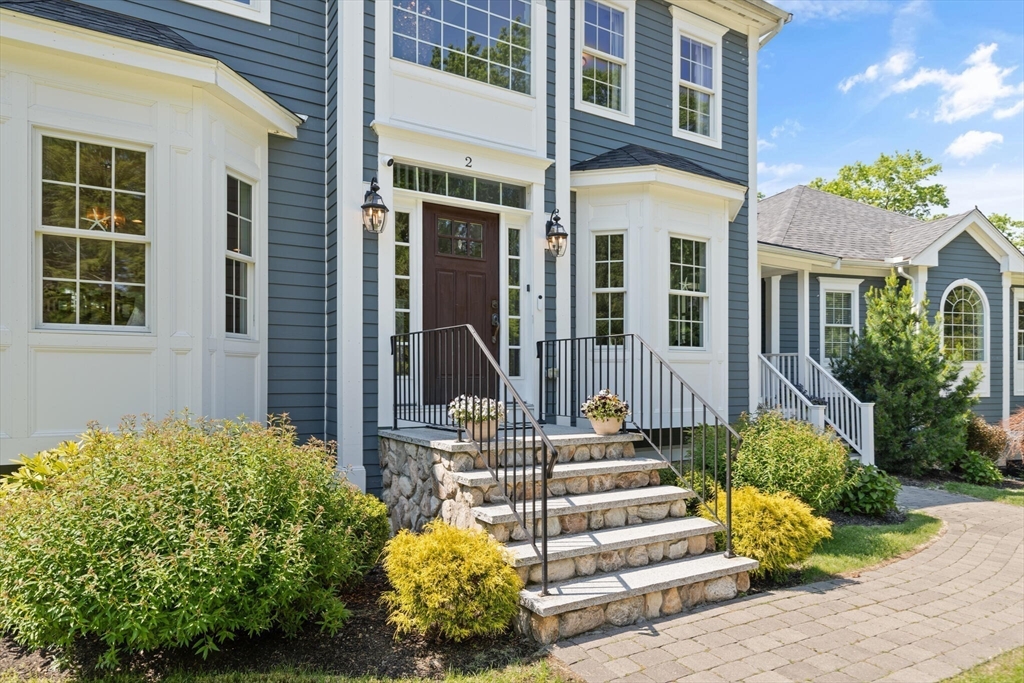 2 Leitner Way Middleton, MA 01949 - Photo 3 of 42 a front view of a house with a garden