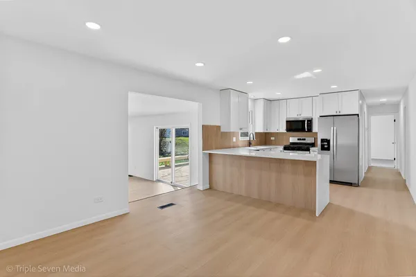 a kitchen with appliances and cabinets