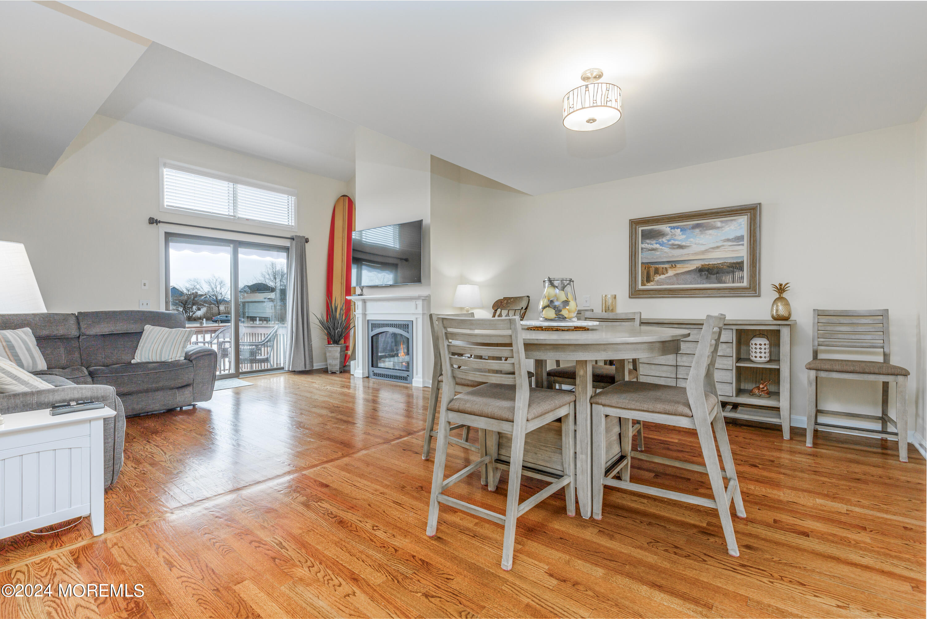 2 Sea Point Drive Point Pleasant, NJ 08742 - Photo 15 of 37 a dining room with furniture wooden floor a rug and a painting