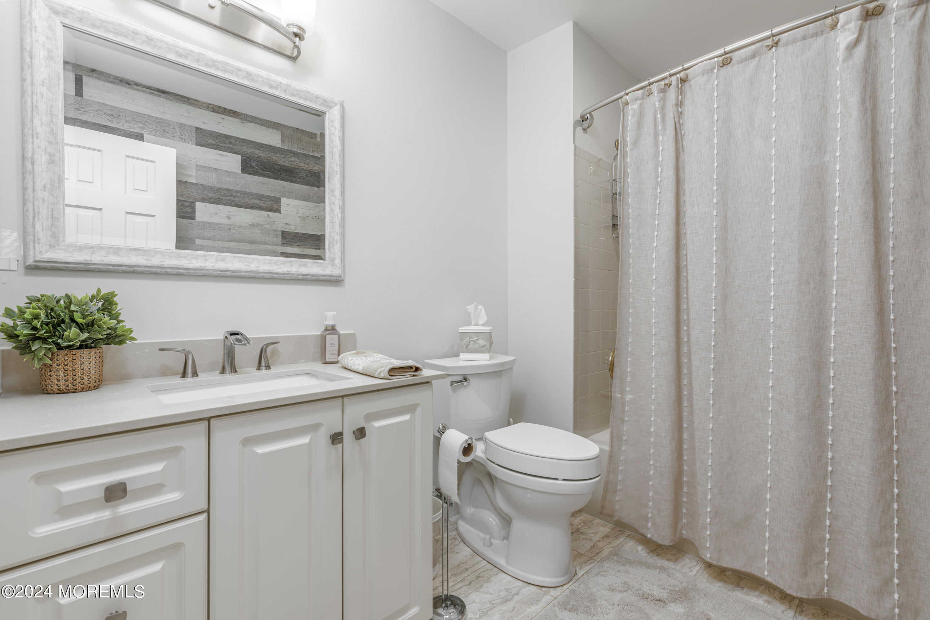 2 Sea Point Drive Point Pleasant, NJ 08742 - Photo 17 of 37 a bathroom with a granite countertop sink and a toilet