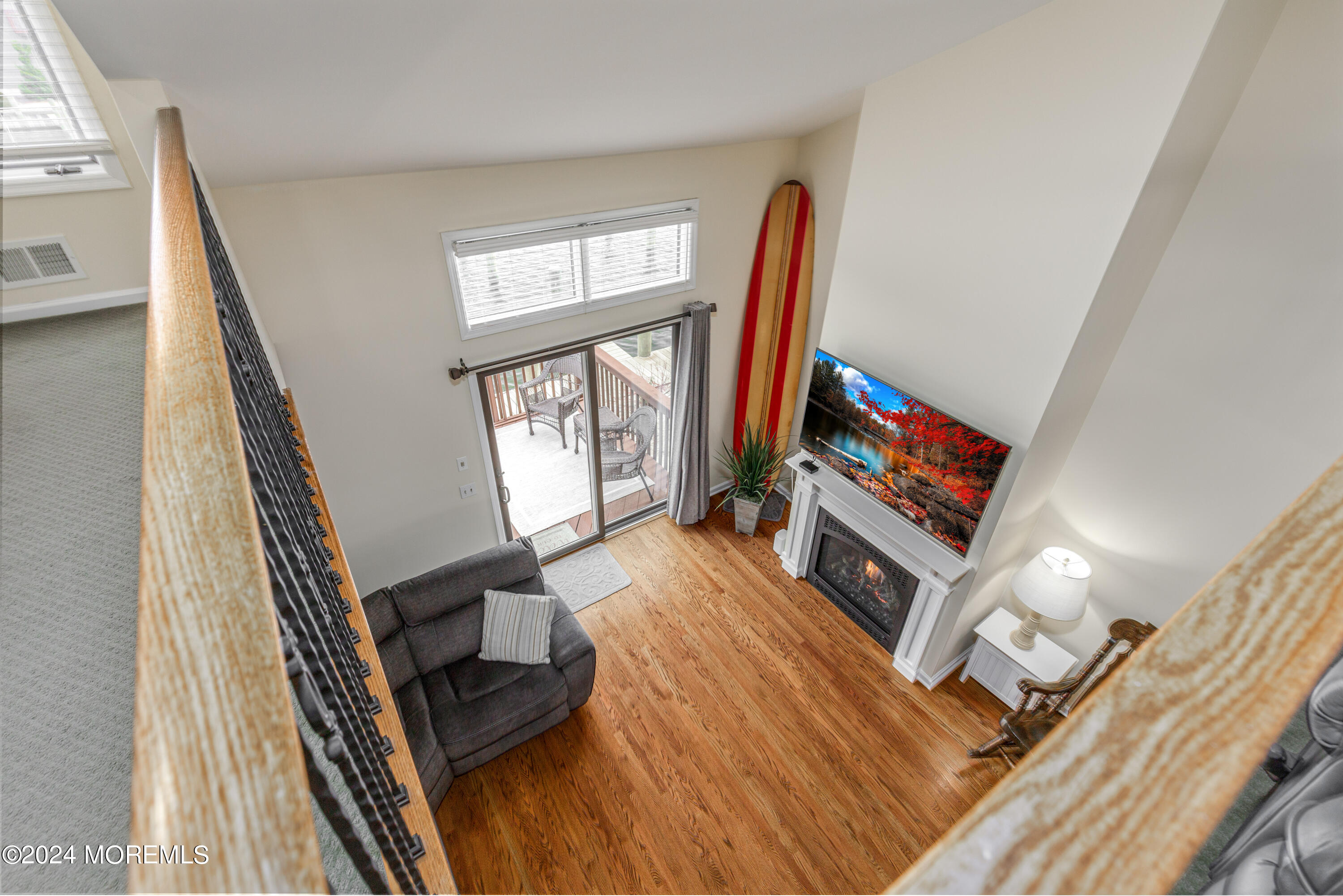 2 Sea Point Drive Point Pleasant, NJ 08742 - Photo 22 of 37 a living room with furniture and a flat screen tv
