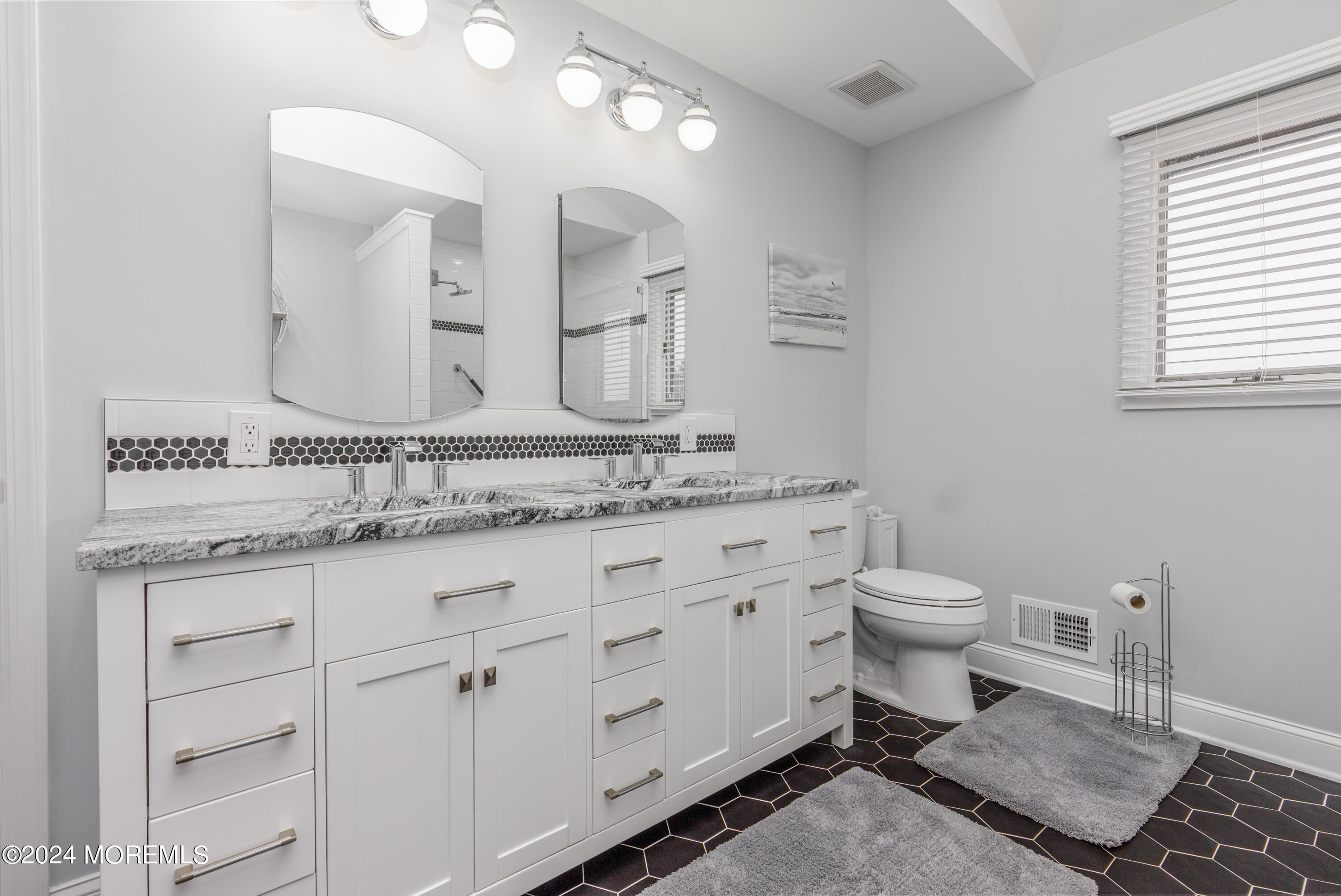 2 Sea Point Drive Point Pleasant, NJ 08742 - Photo 25 of 37 a bathroom with a granite countertop toilet sink and mirror