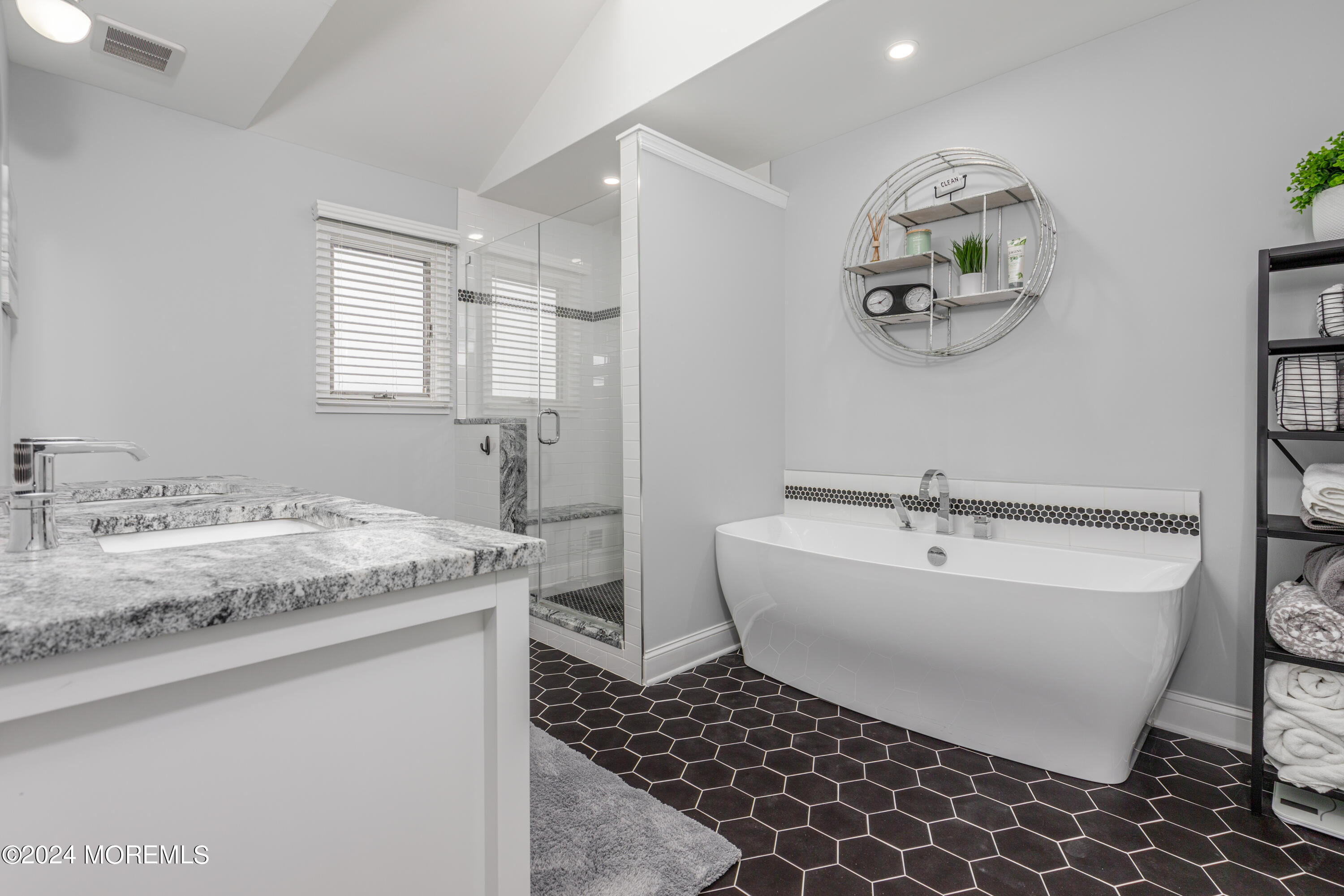 2 Sea Point Drive Point Pleasant, NJ 08742 - Photo 26 of 37 a spacious bathroom with a granite countertop sink and a mirror