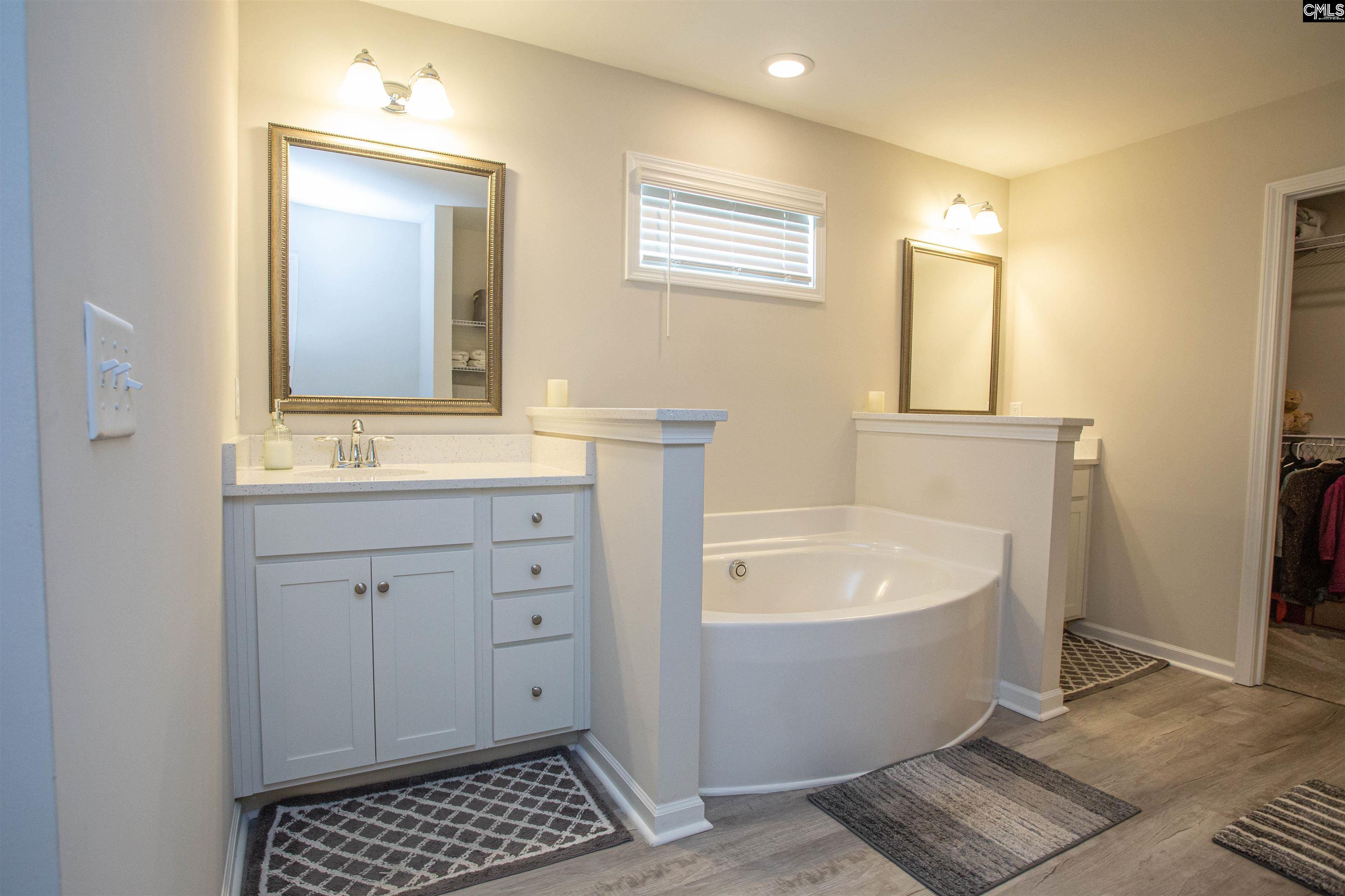 272 Shadowbrook Way Camden, SC 29020 - Photo 18 of 43 a bathroom with a bathtub sink and mirror