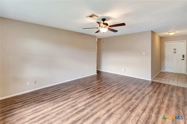 a view of a hallway with windows