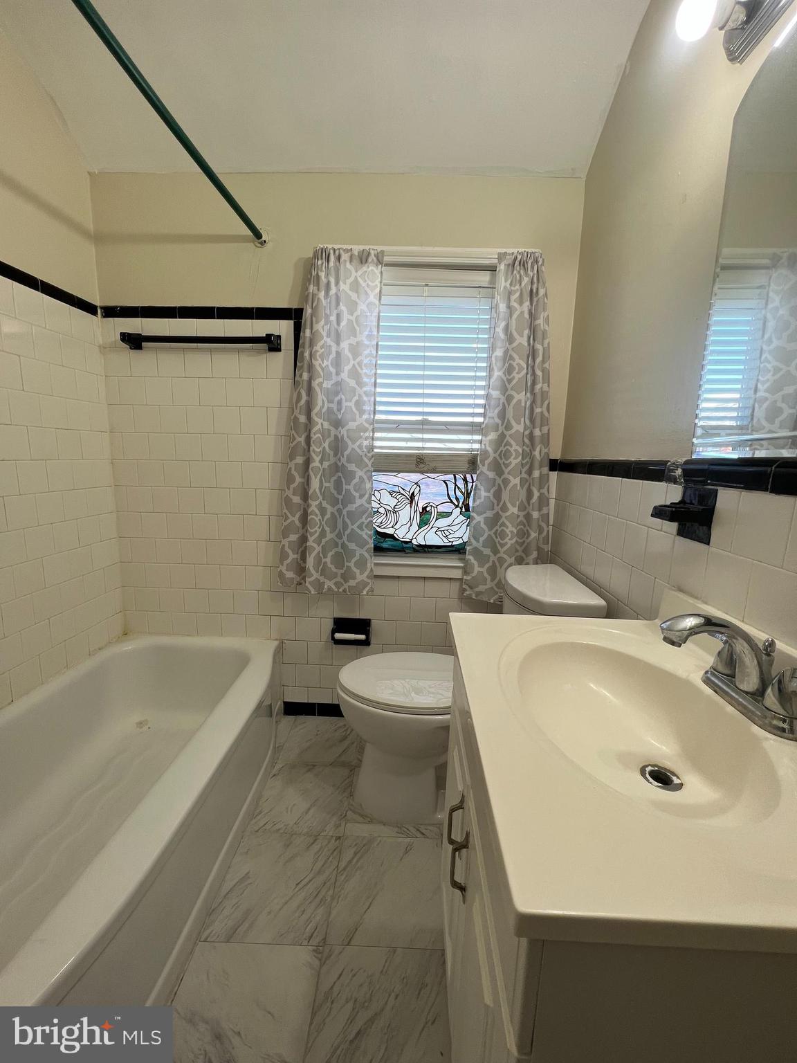 1006 Tunbridge Road Baltimore, MD 21212 - Photo 13 of 19 a bathroom with a sink toilet and shower