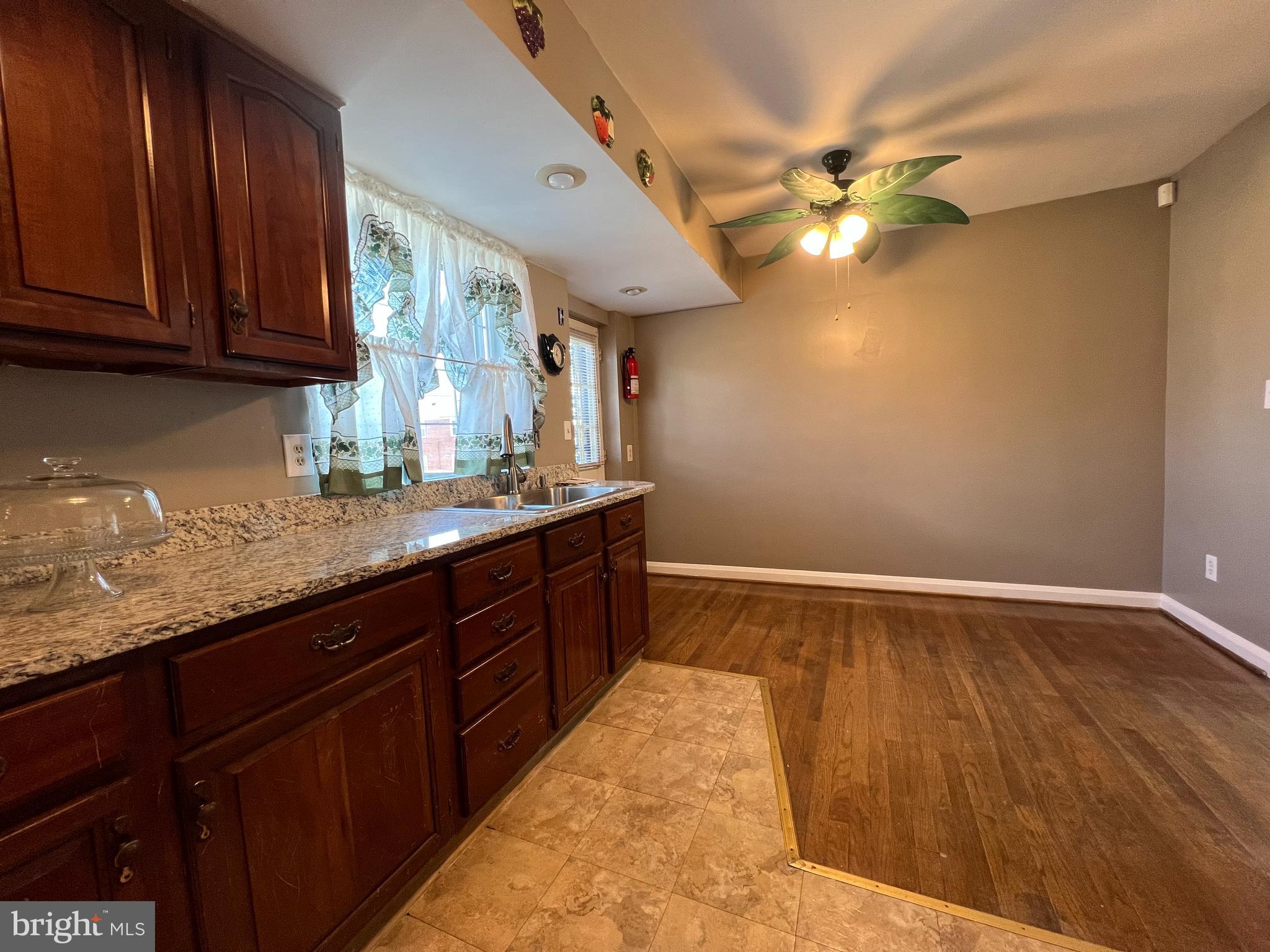 1006 Tunbridge Road Baltimore, MD 21212 - Photo 7 of 19 a kitchen with a sink and cabinets