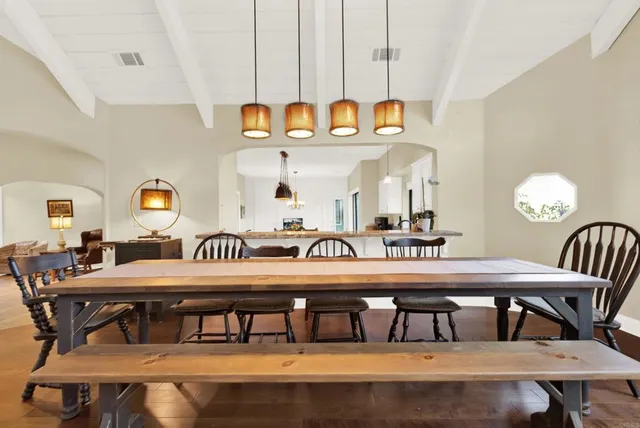 a bedroom with a bed and glass walk in closet