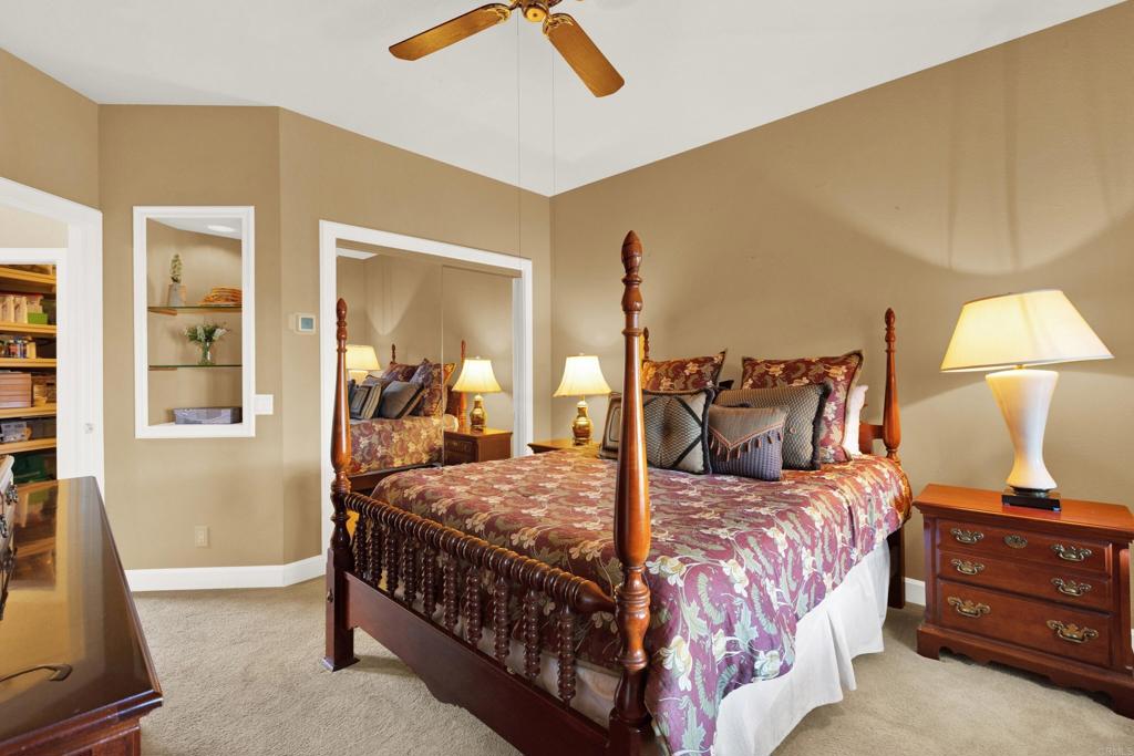 2691 Daisy Lane Fallbrook, CA 92028 - Photo 44 of 70 a bedroom with a bed and wooden floor