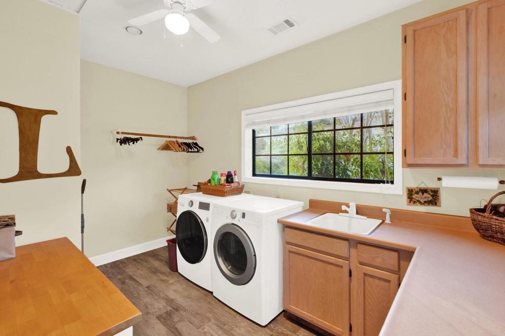2691 Daisy Lane Fallbrook, CA 92028 - Photo 45 of 70 a utility room with sink dryer and washer