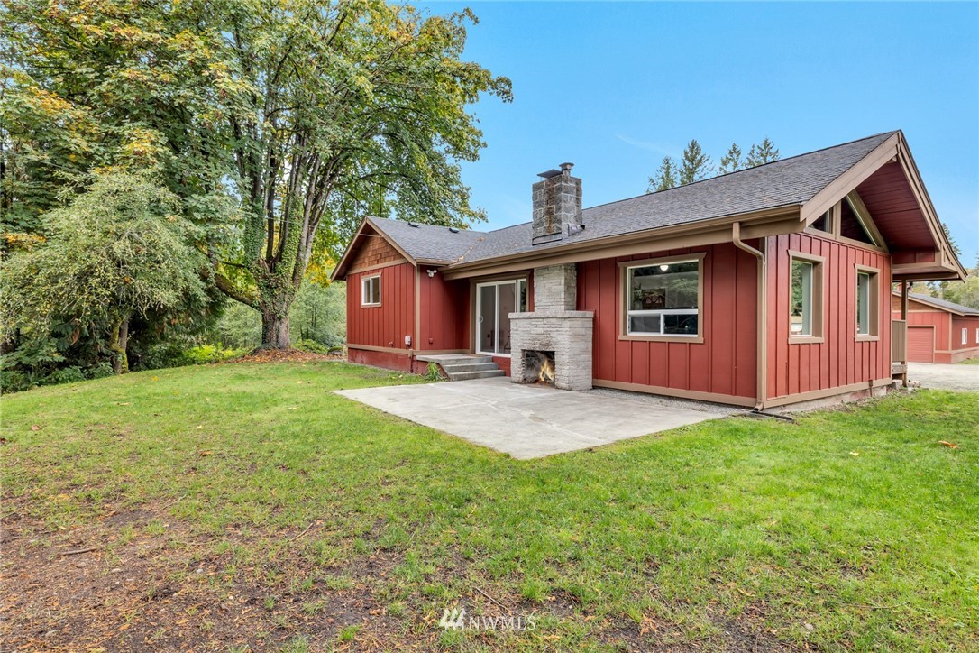 20260 Maxwell Road Southeast Maple Valley, WA 98038 - Photo 2 of 38 a front view of a house with yard porch and green space