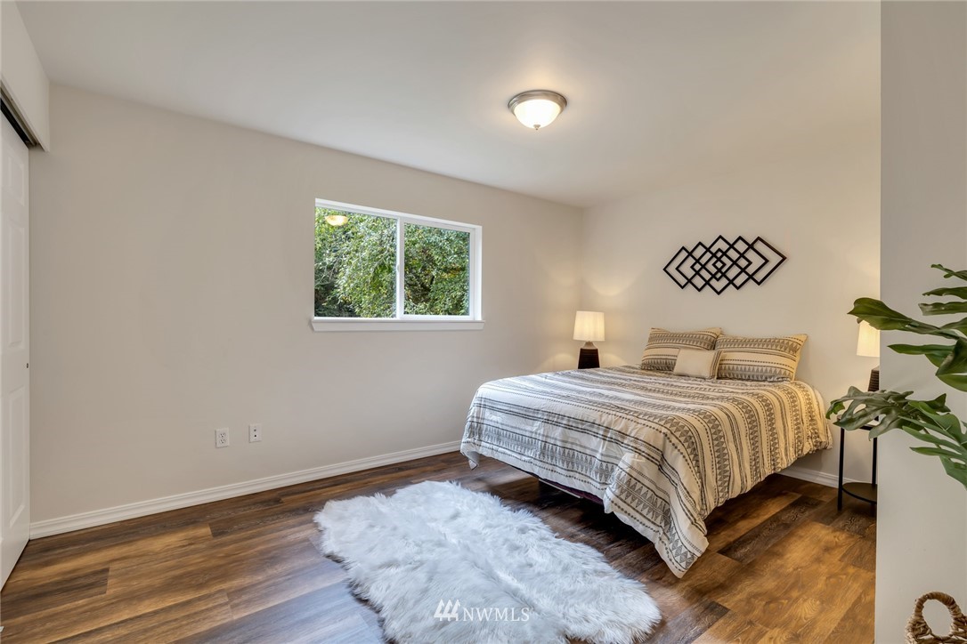 20260 Maxwell Road Southeast Maple Valley, WA 98038 - Photo 14 of 38 a bedroom with a bed and a table