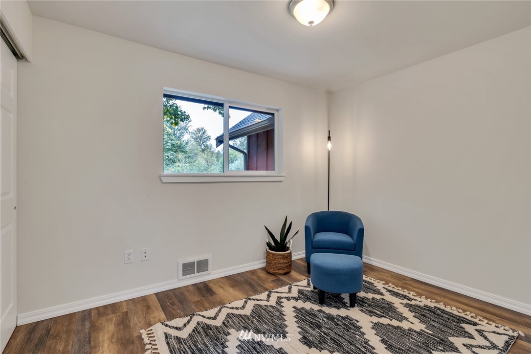 20260 Maxwell Road Southeast Maple Valley, WA 98038 - Photo 16 of 38 a room with furniture and a window