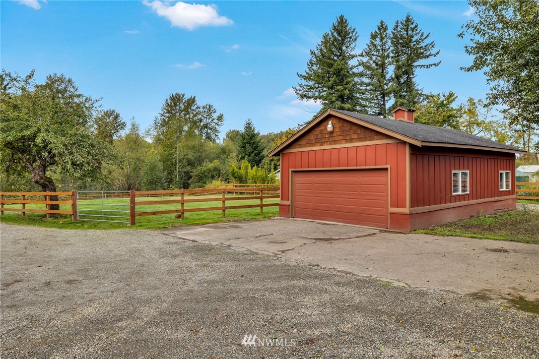 20260 Maxwell Road Southeast Maple Valley, WA 98038 - Photo 33 of 38 a front view of a house with a yard