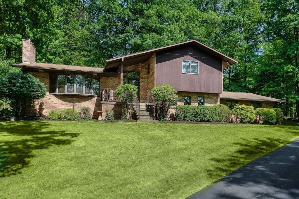 230 Dodds Road Butler, PA 16002 - Photo 2 of 32 a front view of a house with garden
