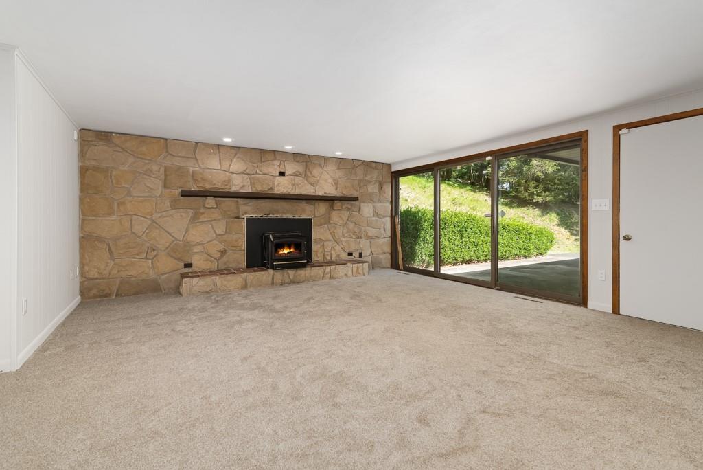 230 Dodds Road Butler, PA 16002 - Photo 25 of 32 a view of an empty room with a fireplace and a window