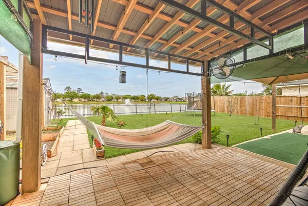 a view of a swimming pool with a porch