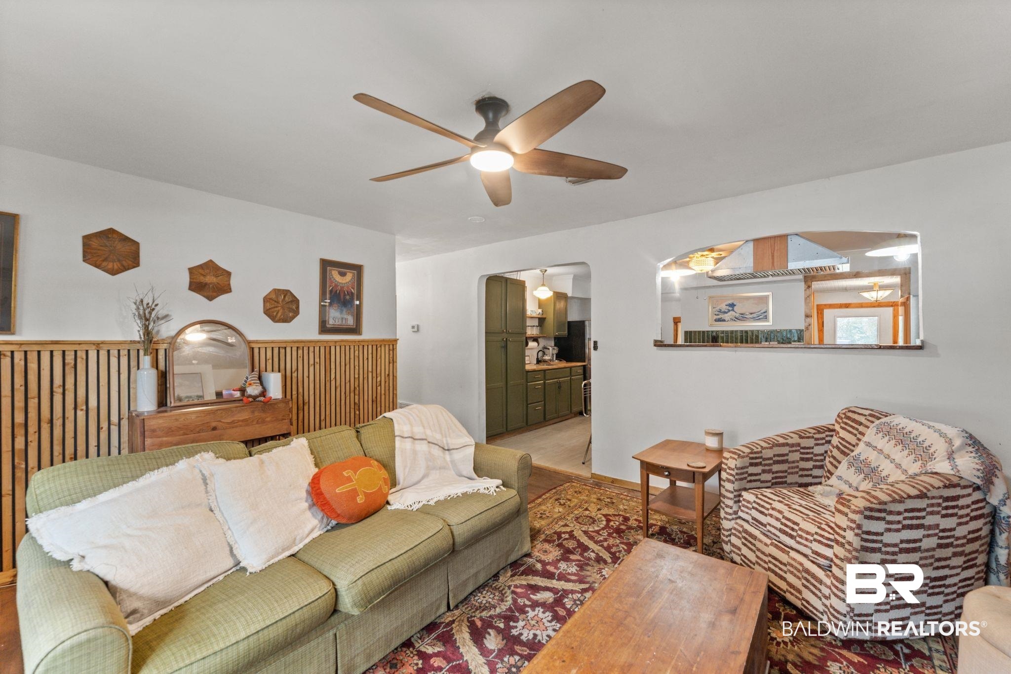 10785 Gregg Road Semmes, AL 36575 - Photo 9 of 35 Living room featuring a ceiling fan, arched walkways, and wood finished floors
