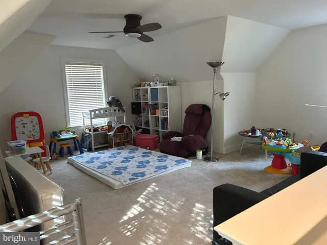 a living room with lots of furniture and decor