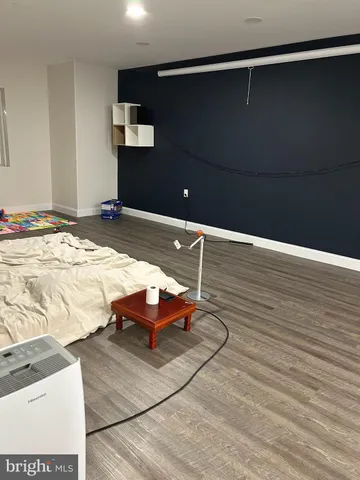 a bedroom with a bed and lamp