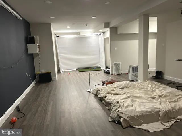 a bed room with a bed and a large window